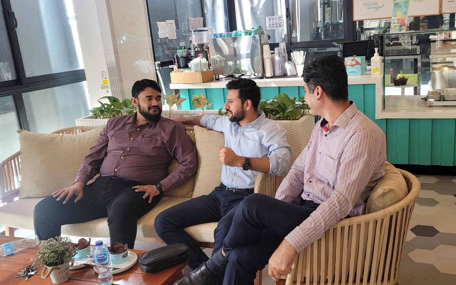 Three Pragmatic Solutions team members in a working discussion