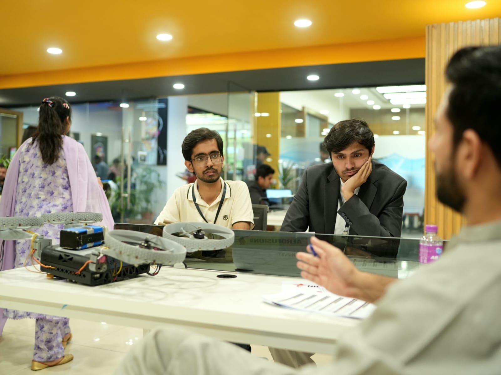 Engineering discussion with drone equipment on the table