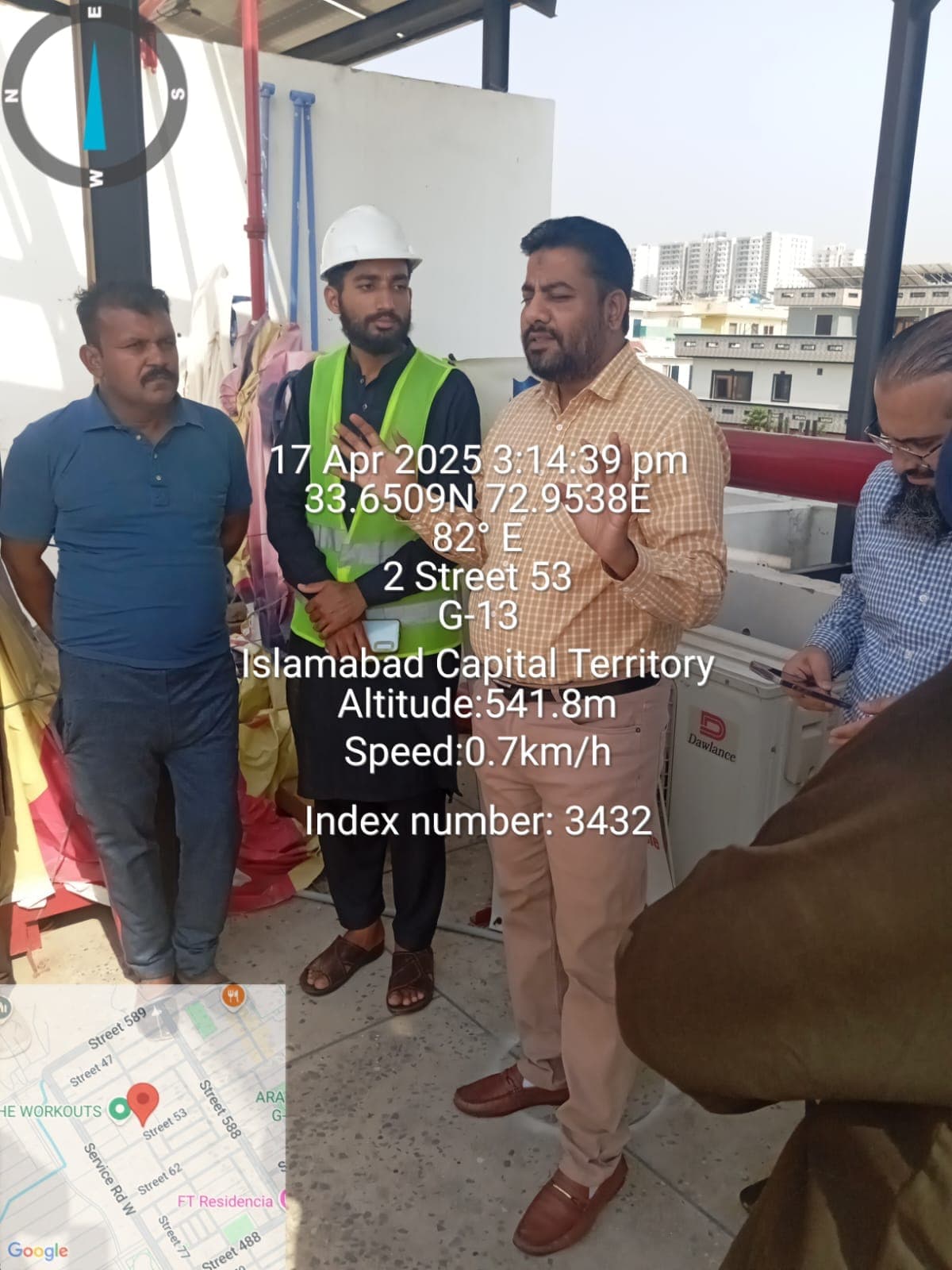 Site inspection team reviewing rooftop safety and work conditions