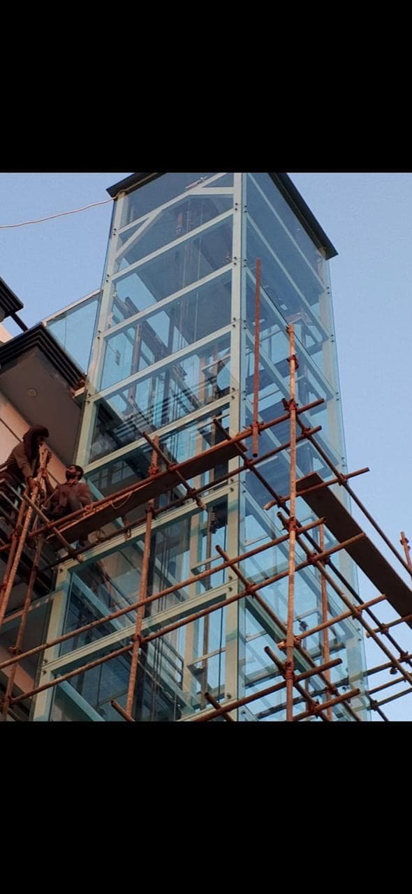 Glass elevator shaft under construction